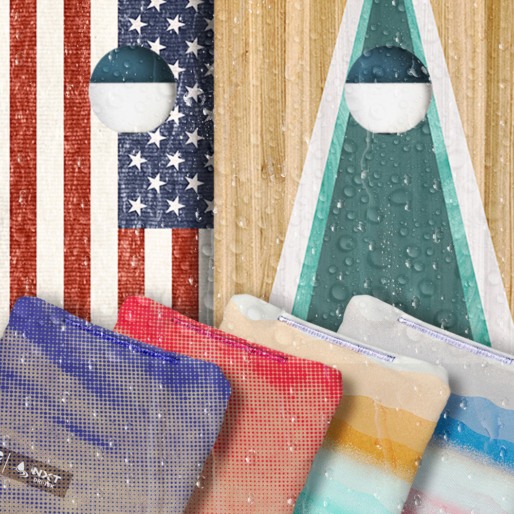 Cornhole boards and bags with water droplets.